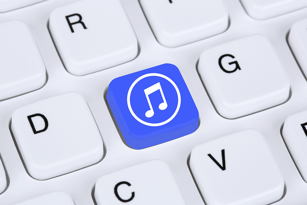 Listening to music on internet computer Listening to music on internet computer keyboard