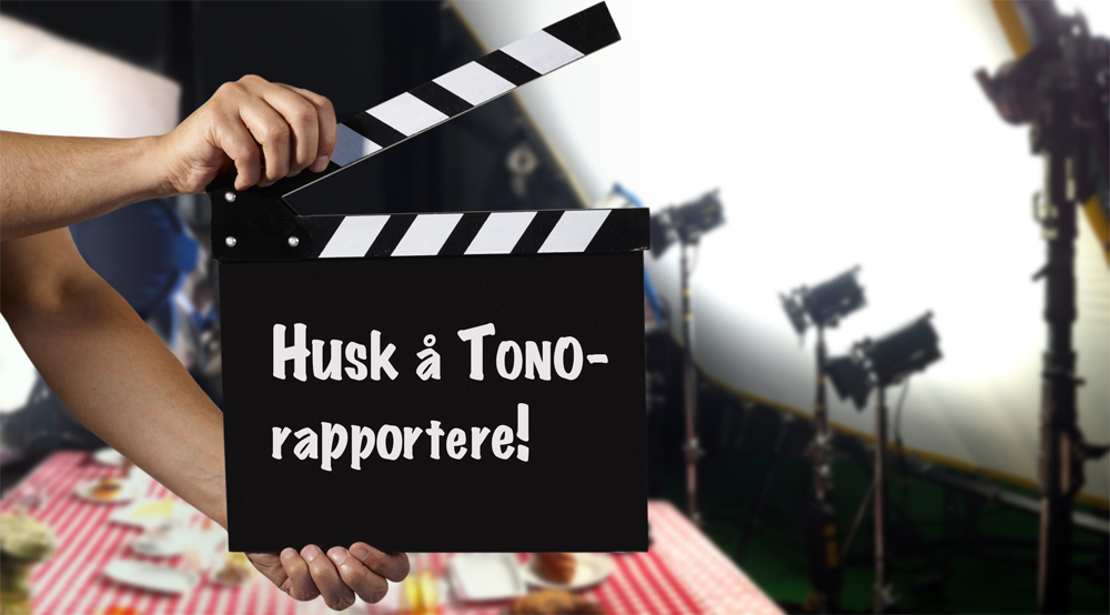 Man holding a clapper Man holding film slate on a film set