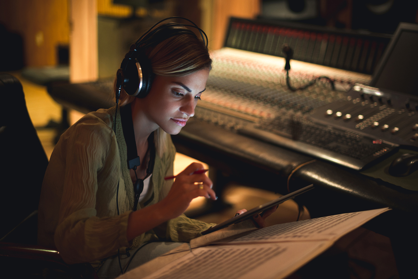 Writing her next song Young musician writing her next song in a music studio.