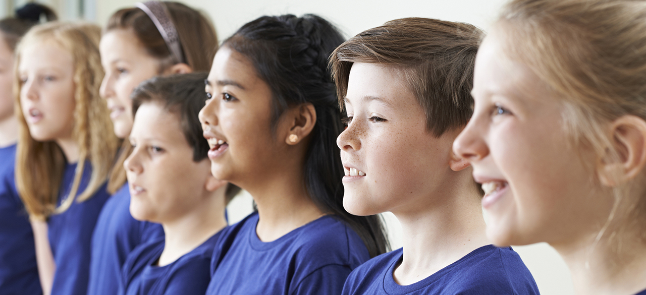 Group Of School Children Singing In Choir Together Group Of School Children Singing In Choir Together