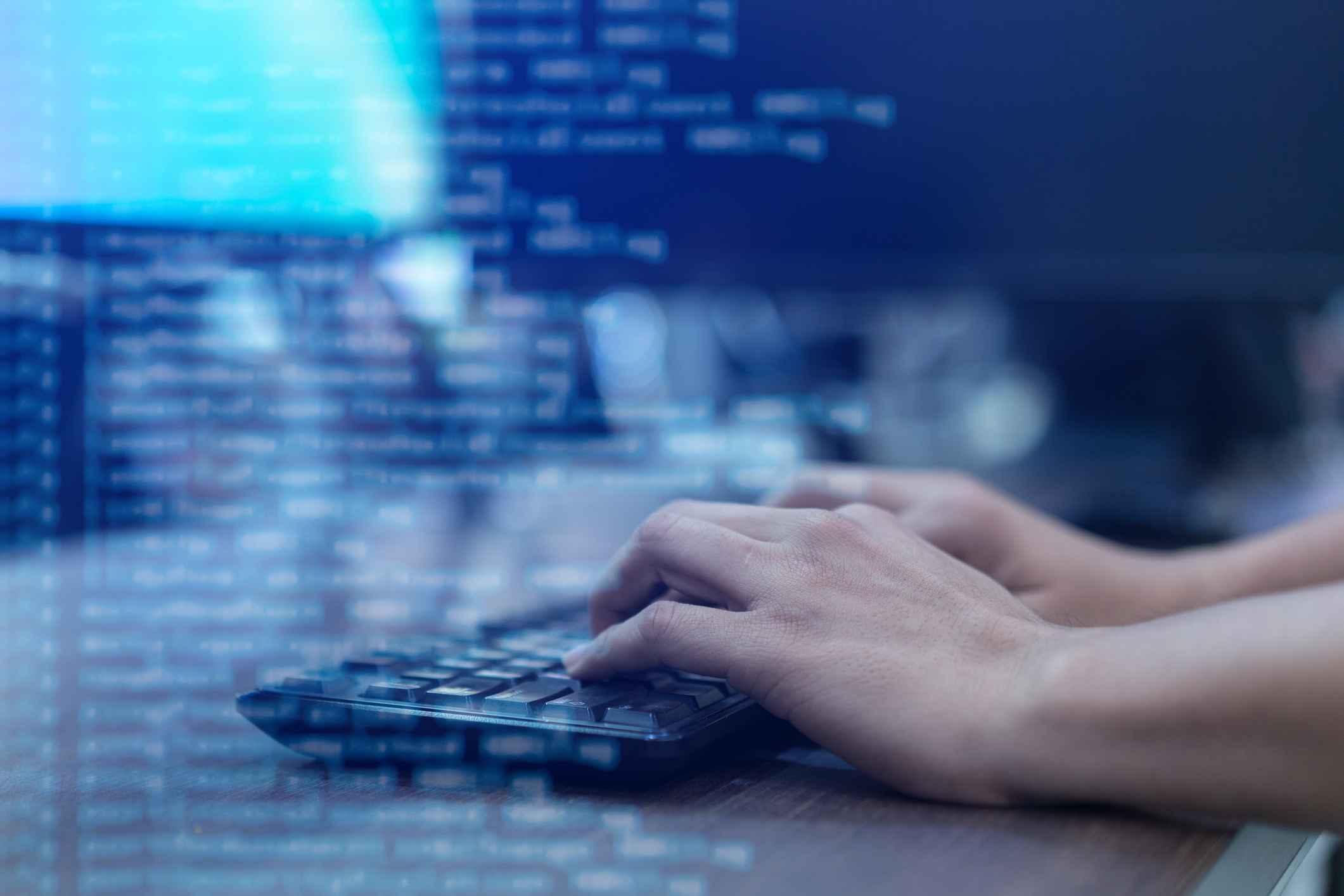 close up programmer man hand typing on keyboard at computer desktop for input coding language to software for fix bug and defect of system in operation room , technology concept close up programmer man hand typing on keyboard at computer desktop for input coding language to software for fix bug and defect of system in operation room , technology concept